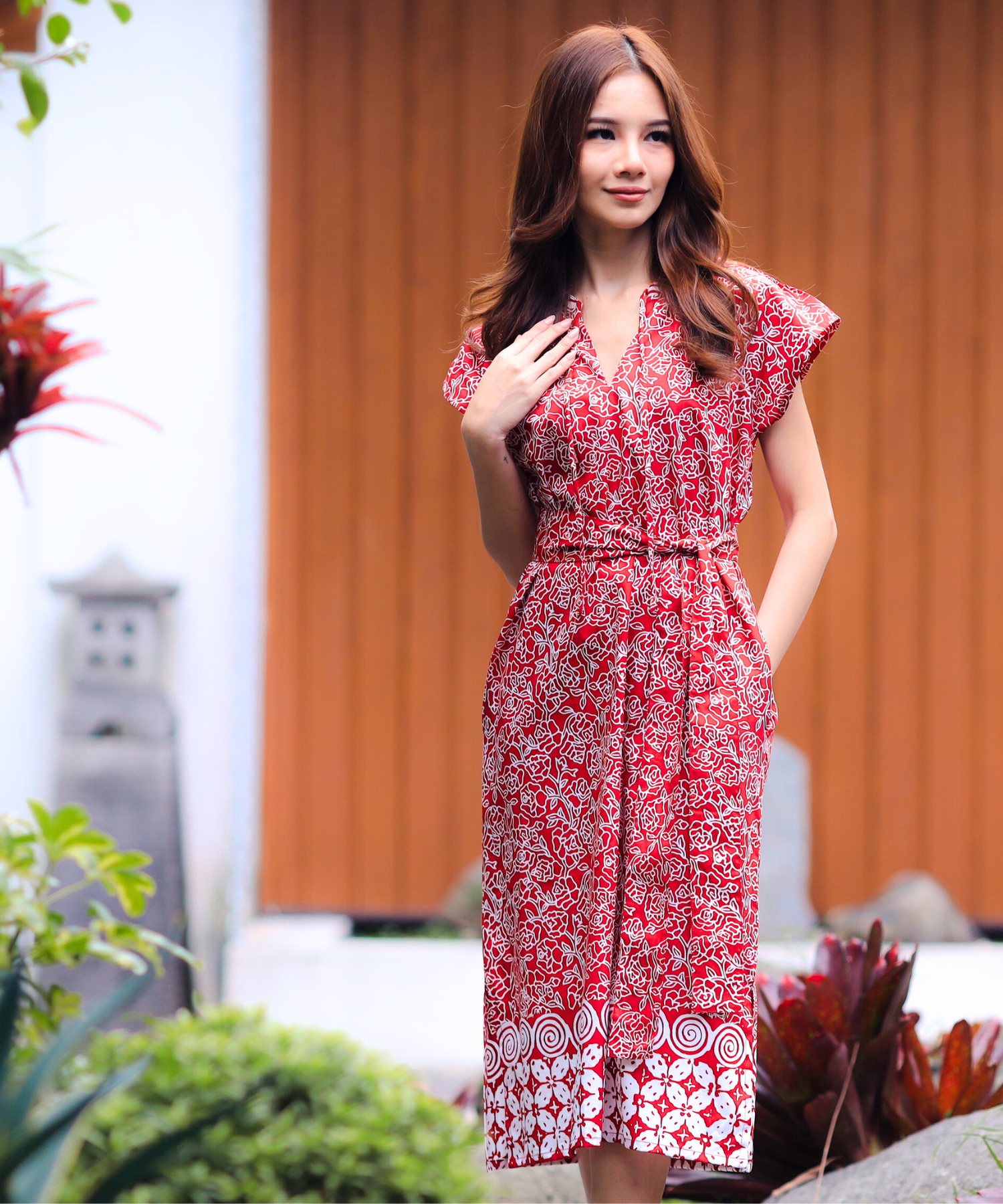Woman wearing red formal day dress.